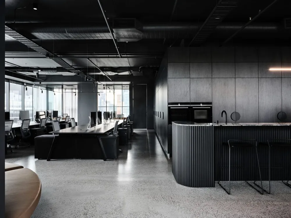 Modern dark creative agency office interior representing MADE + SEEN complete package