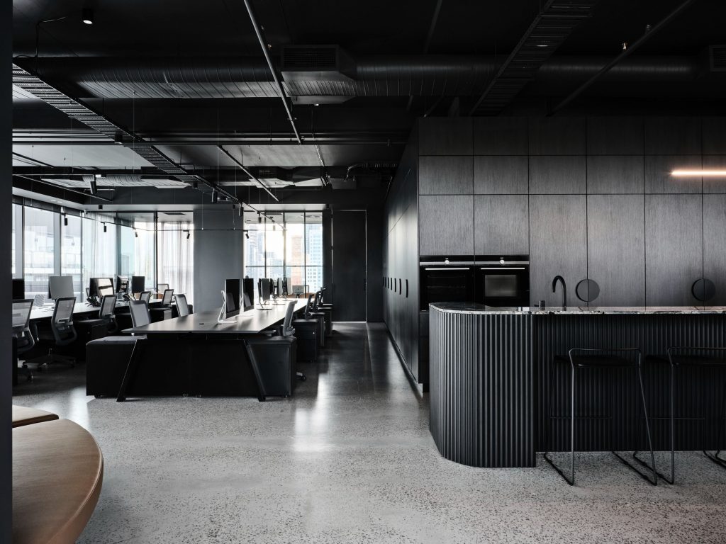 Modern dark creative agency office interior representing MADE + SEEN complete package